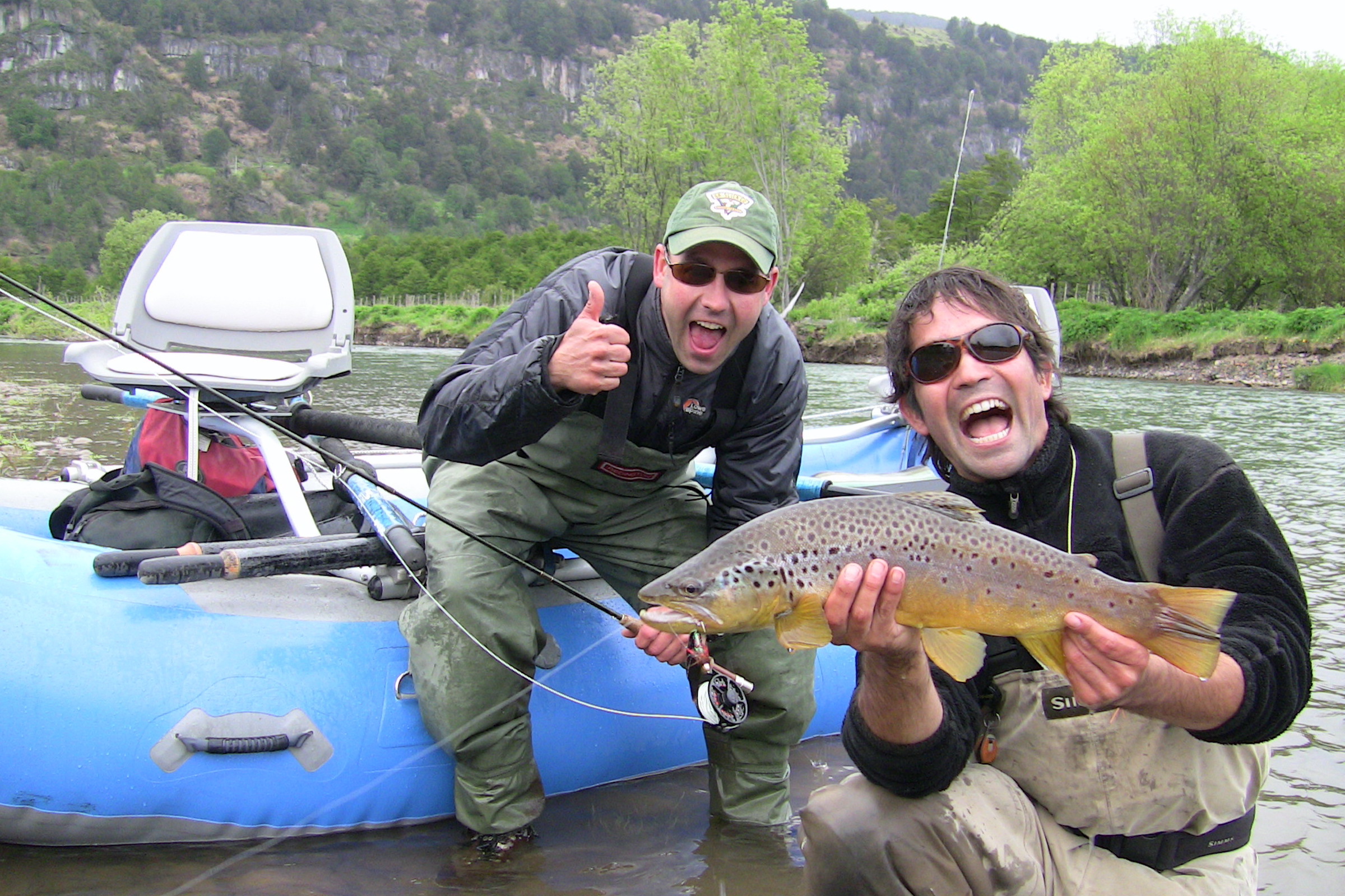 Fishermen with brown trout in Aysen