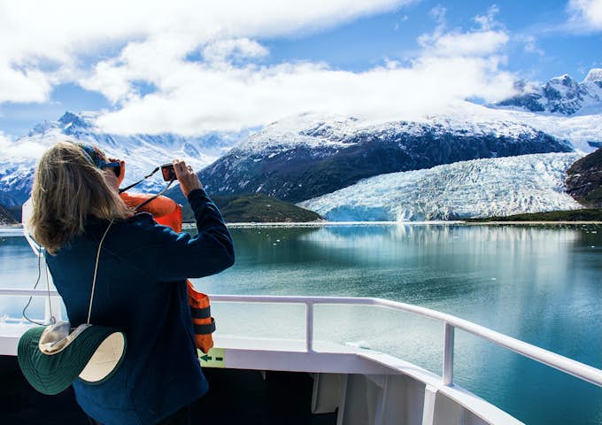Cruise passenger takes photo of a glacier from an Australis ship