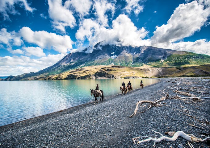 Horseback riding at Lake Nordenskjöld, Torres del Paine, Patagonia, Chile