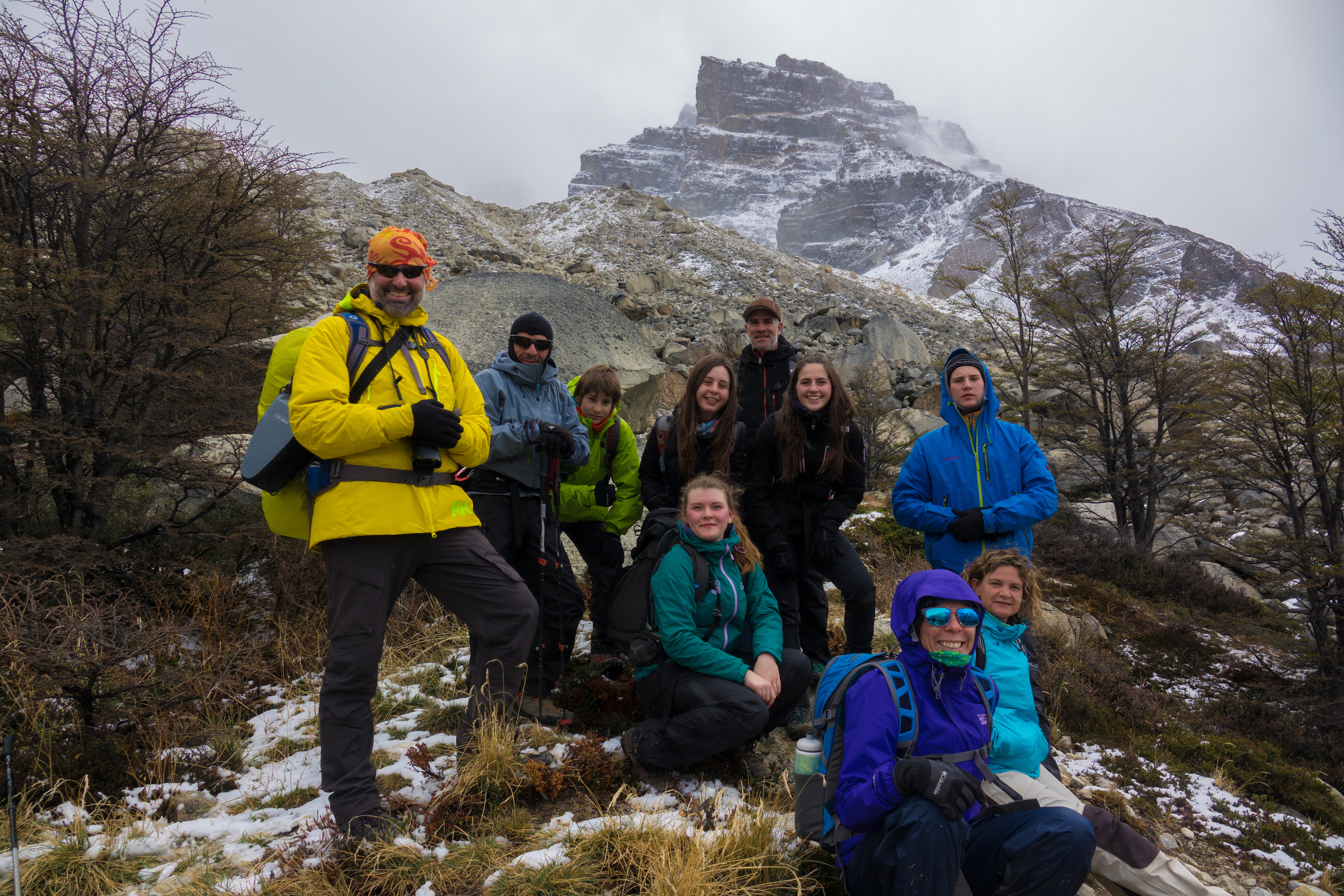 Ten hikers doing the W Trek in snowy conditions in Torres del Paine National Park. Torres del Paine Hike, Chile 