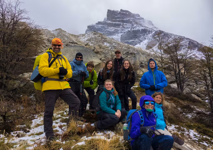 Ten hikers doing the W Trek in snowy conditions in Torres del Paine National Park. Torres del Paine Hike, Chile