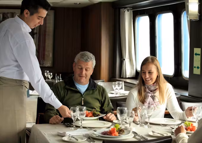 People dining, passengers eating on Ventus Australis Patagonian cruise ship, Patagonia