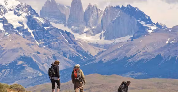 Hikers walking towards the base of the Towers in Torres del Paine