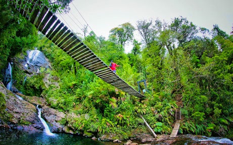 Crossing the suspension bridge, Futangue Park, Patagonia, Chile