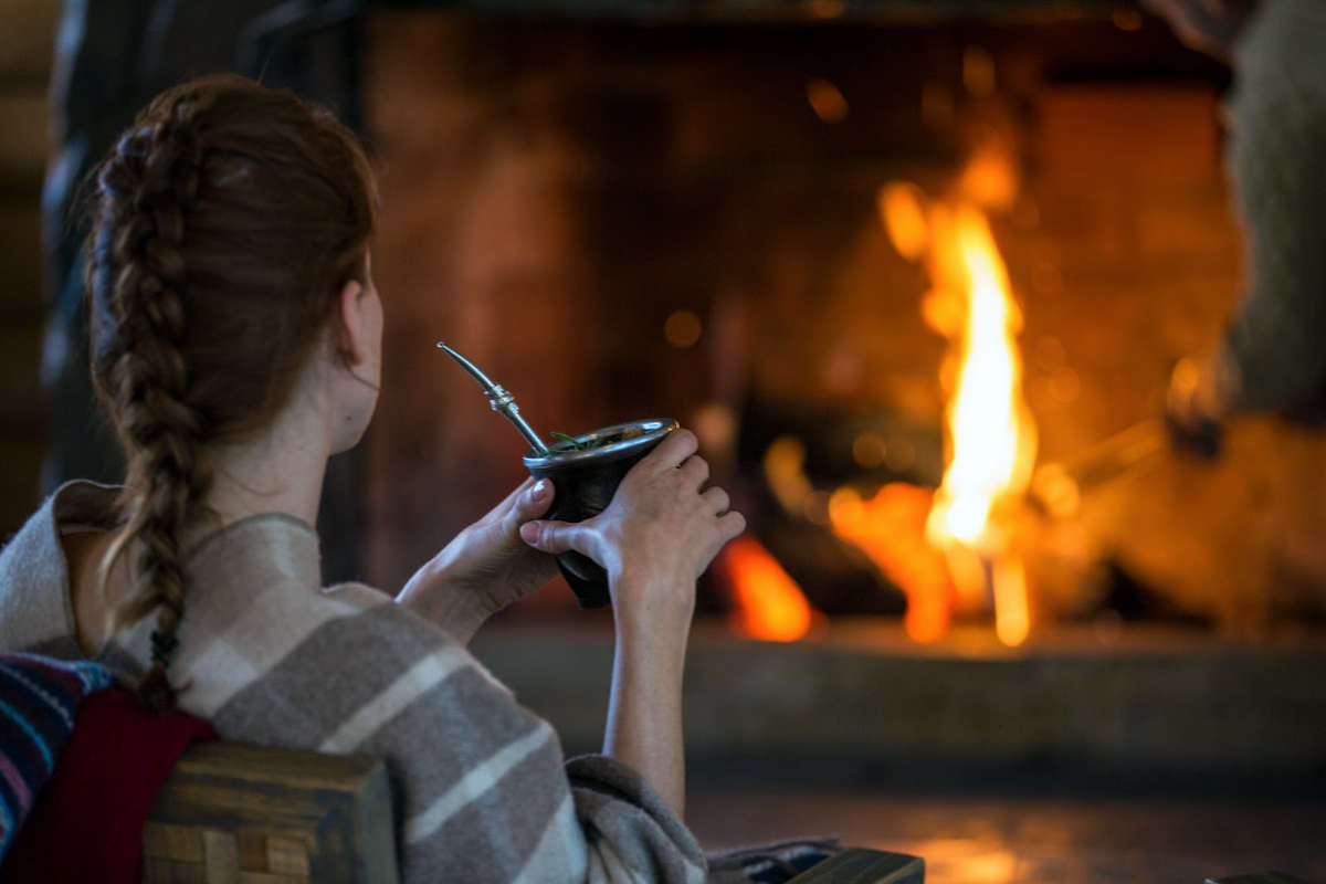 Relaxing by the fire, Hotel Las Torres, Torres del Paine, Patagonia, Chile
