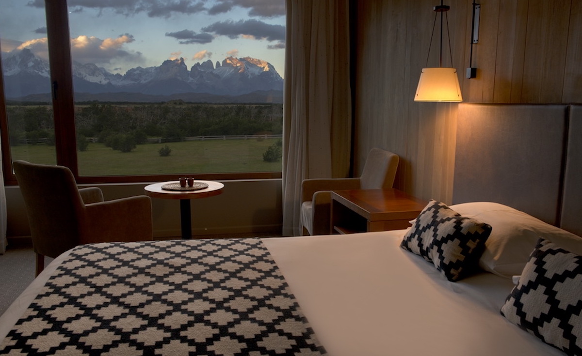 Bedroom with view at Hotel Rio Serrano in Torres del Paine