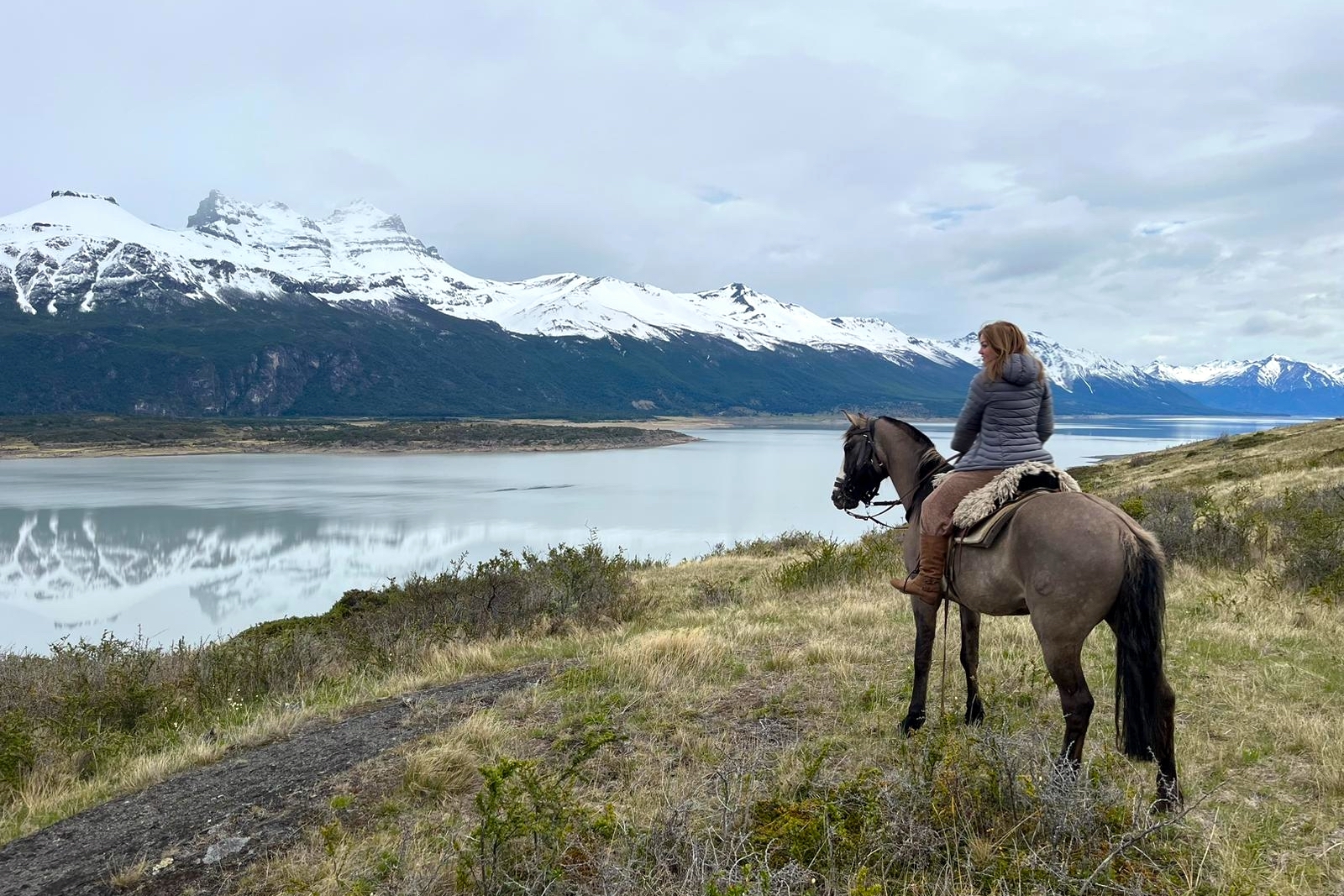 Tourist horseriding near Nibepo aike estancia in Los Glaciares