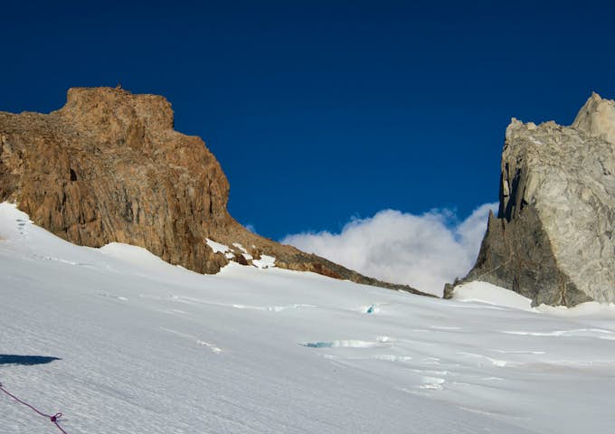 A climber on the snow in the approach to Cerro Mojon Rojo near El Chaltén