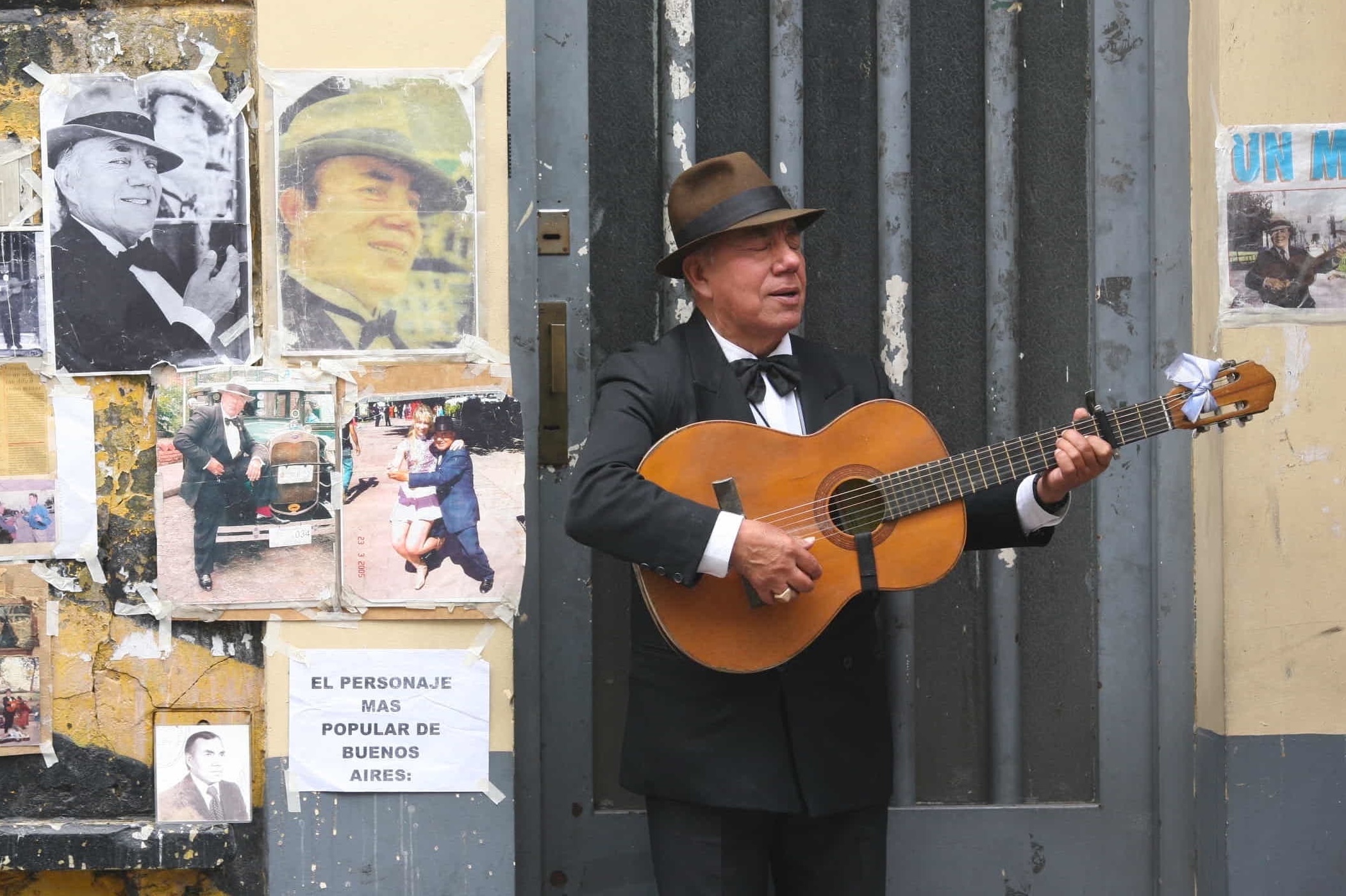 man playing tango guitar on a Buenos Aires street