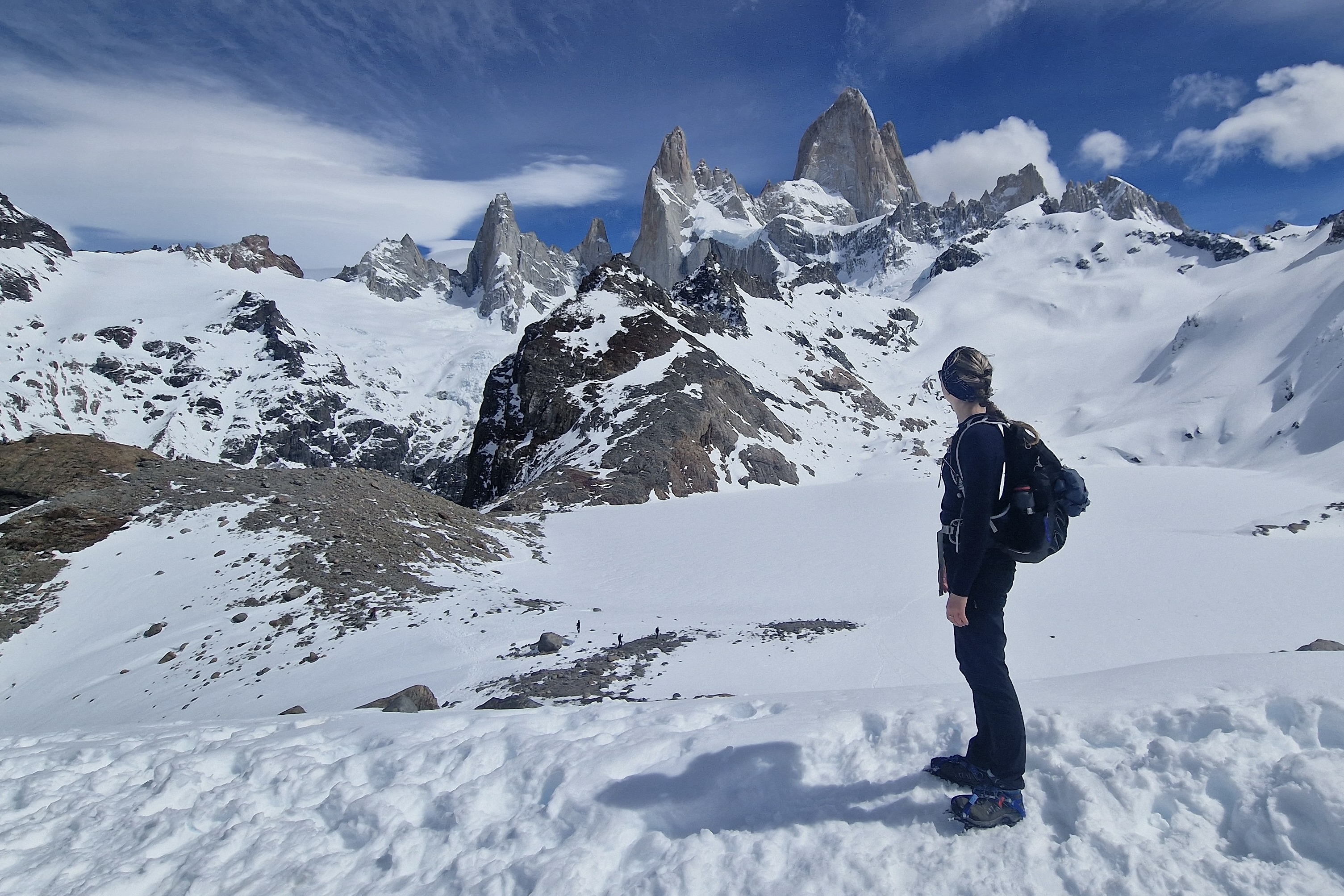 Hiker at Laguna de Los Tres in the snow