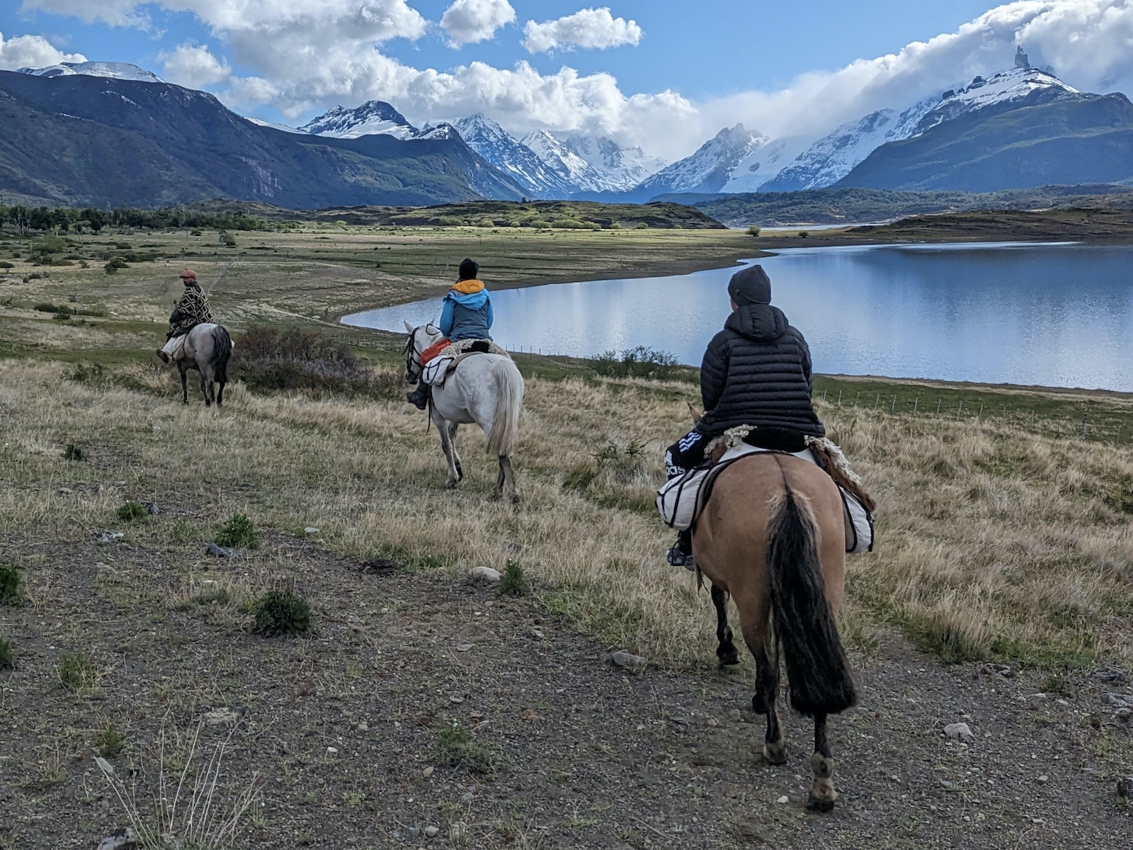 Two tourists and a gaucho riding to hidden glaciers in Los Glaciares