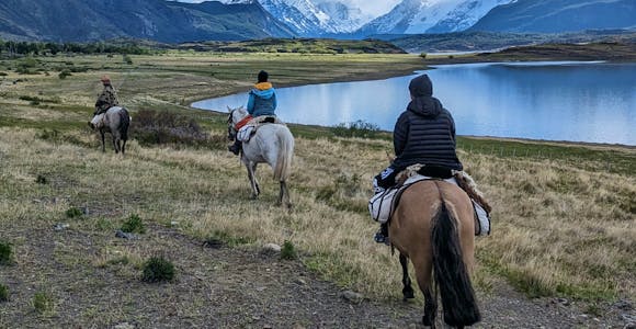 Two tourists and a gaucho riding to hidden glaciers in Los Glaciares