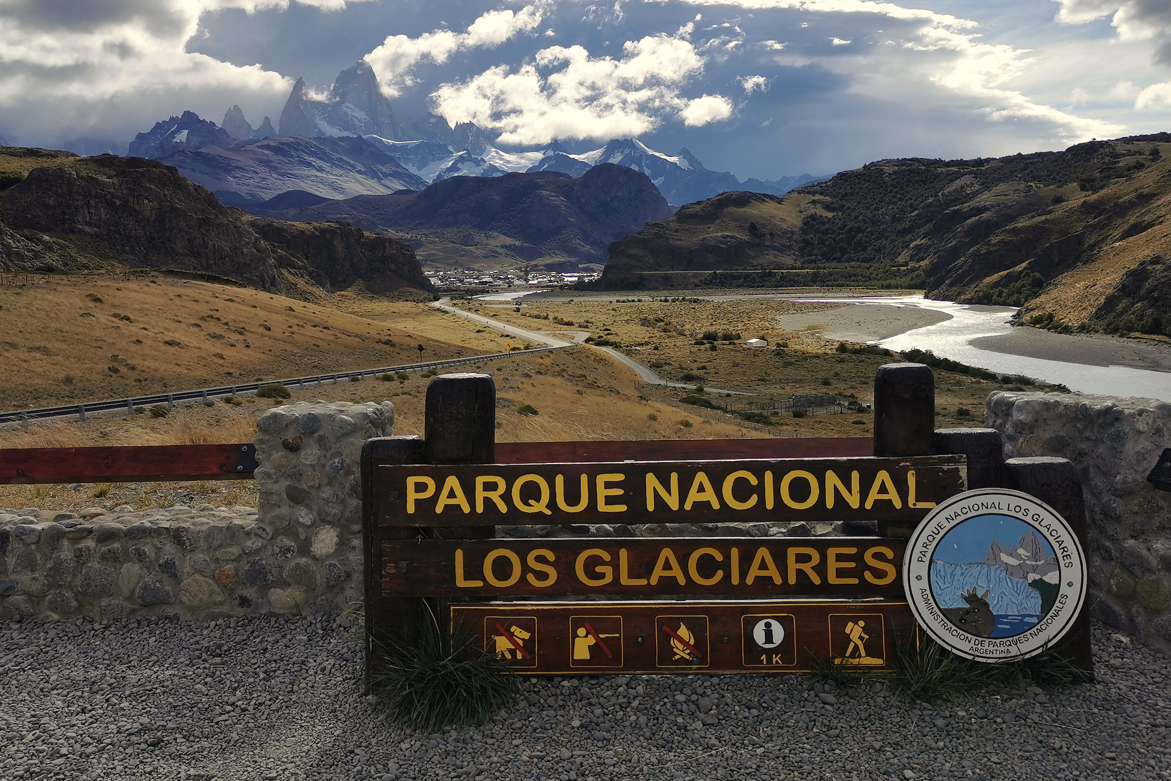 View of Fitz Roy massif with Los Glaciares national park sign in foreground