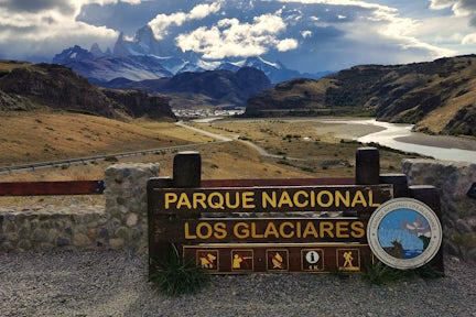 View of Fitz Roy massif with Los Glaciares national park sign in foreground