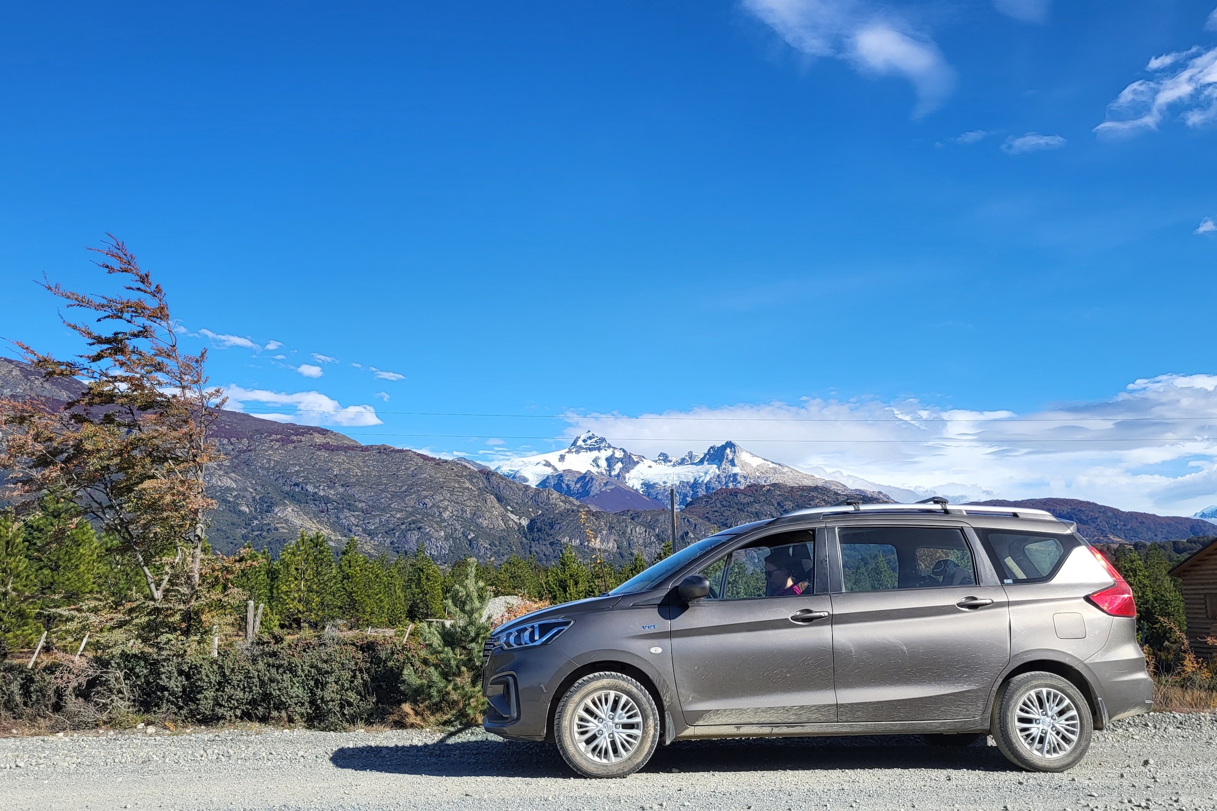 Car on the Carretera Austral highway with mountain background