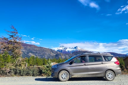 Car on the Carretera Austral highway with mountain background