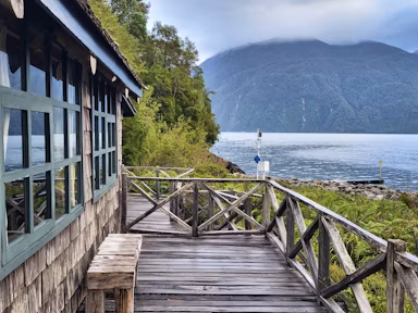 View from the balcony of the wooden cabin-style Caleta Gonzalo Lodge near Pumalin Douglas Tompkins National Park in Chile