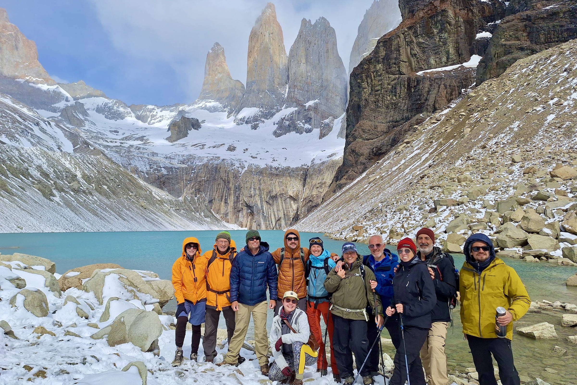 Swoop group tour with hikers at the base of the towers in Torres del Paine