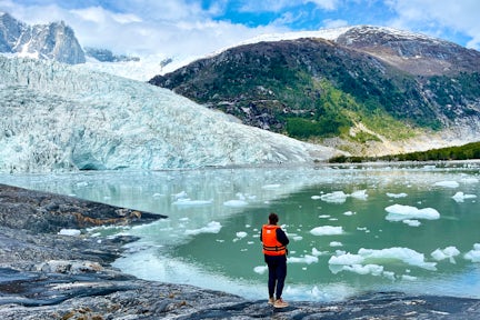 Tourist looking at Pia Glacier in Tierra del Fuego