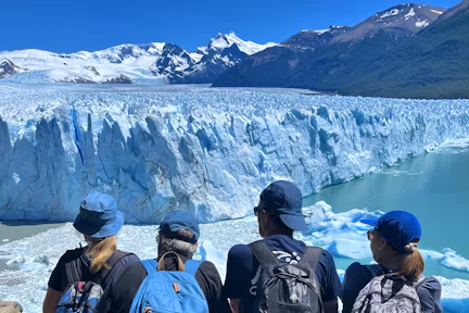 Tourist at the viewpoint overlooking Perito Moreno glacier in Los Glaciares