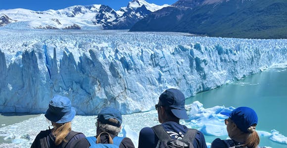 Tourist at the viewpoint overlooking Perito Moreno glacier in Los Glaciares