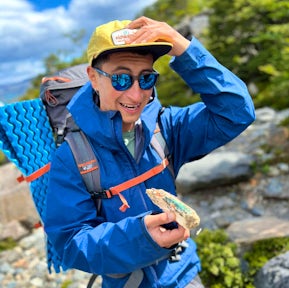 Examining a lentil mushroom at Lake Nordenskjold, Torres del Paine, Patagonia, Chile