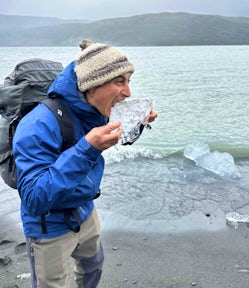 Trying a Patagonian popsicle from the Grey Glacier, Torres del Paine, Patagonia, Chile