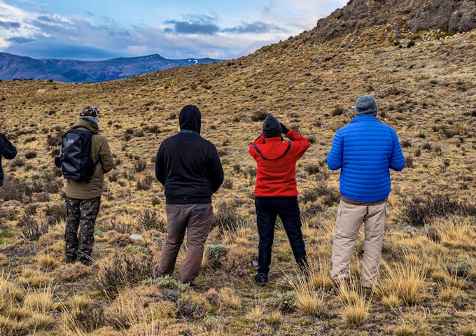 Tourists on a puma tracking tour in Torres del Paine