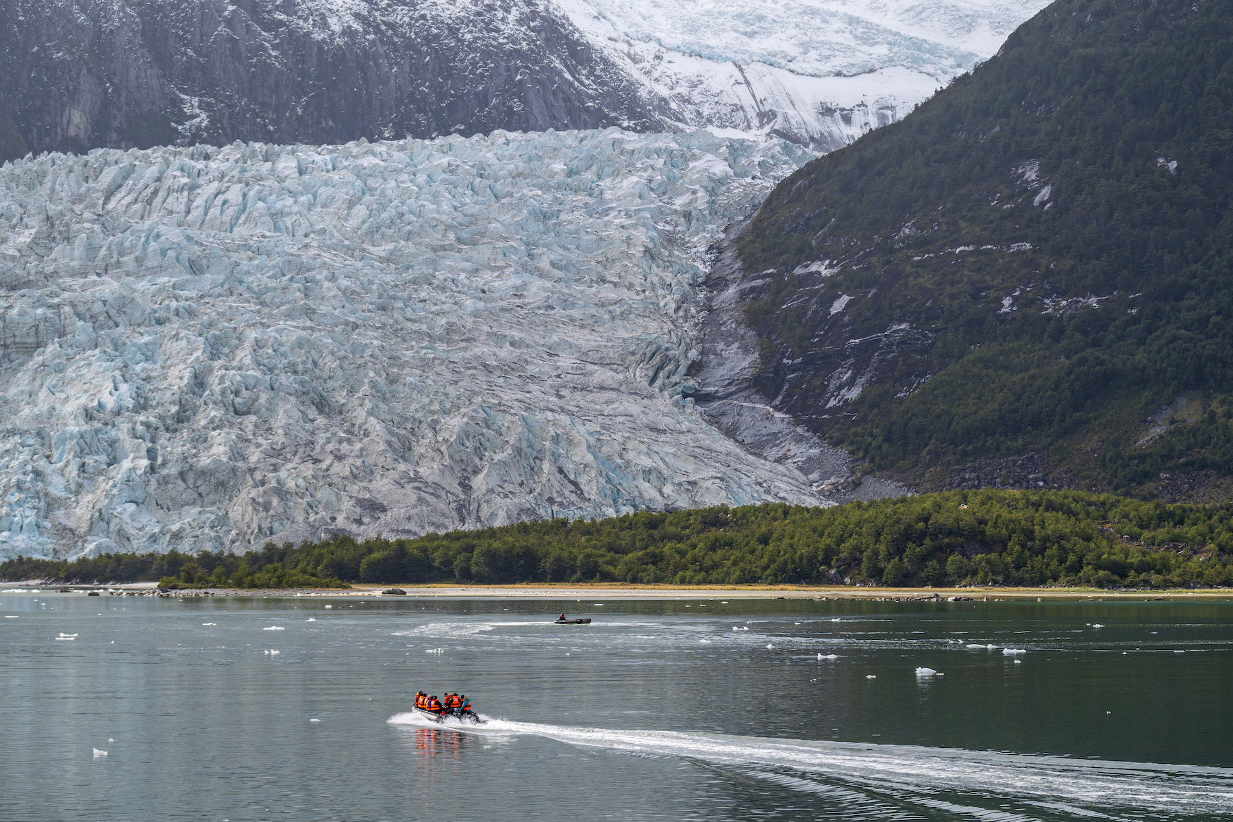 Zodiacs near a glacier in Tierra del Fuego