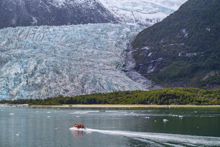 Zodiacs near a glacier in Tierra del Fuego