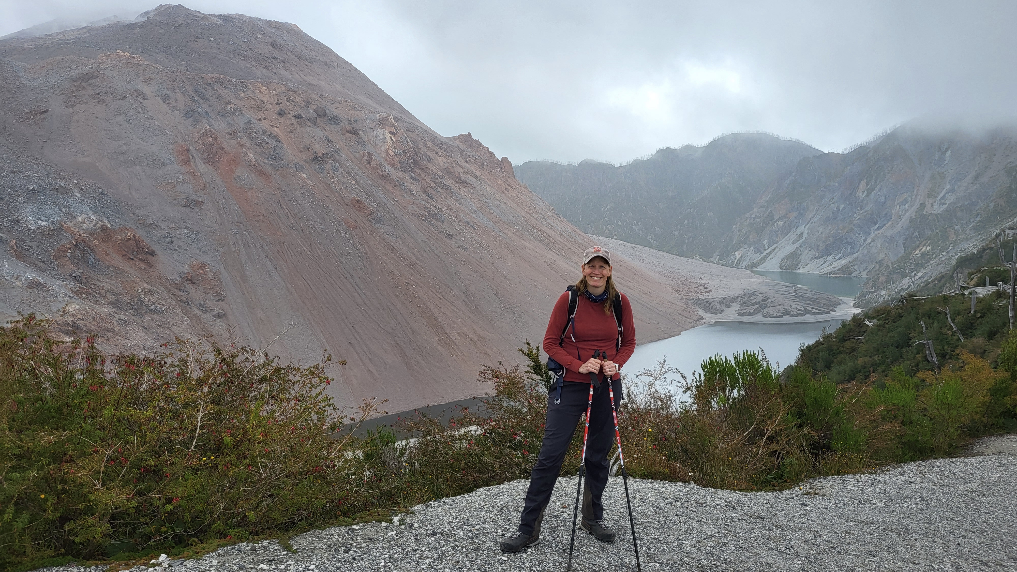 Hiker at the caldera of Chaitén Volcano in Pumalín Douglas Tomplins National Park, Chile