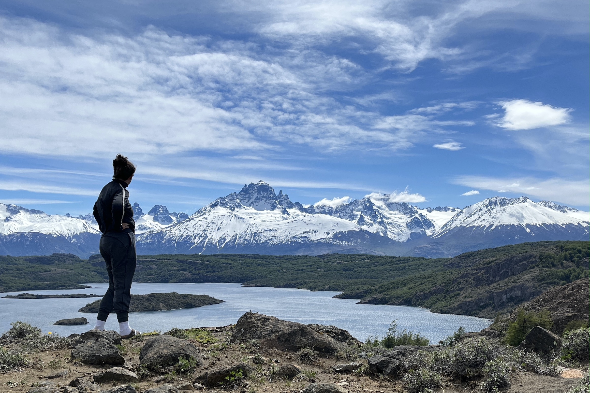 Person looking out over the mountains on the Cerro Castillo trek in Aysen in Chile