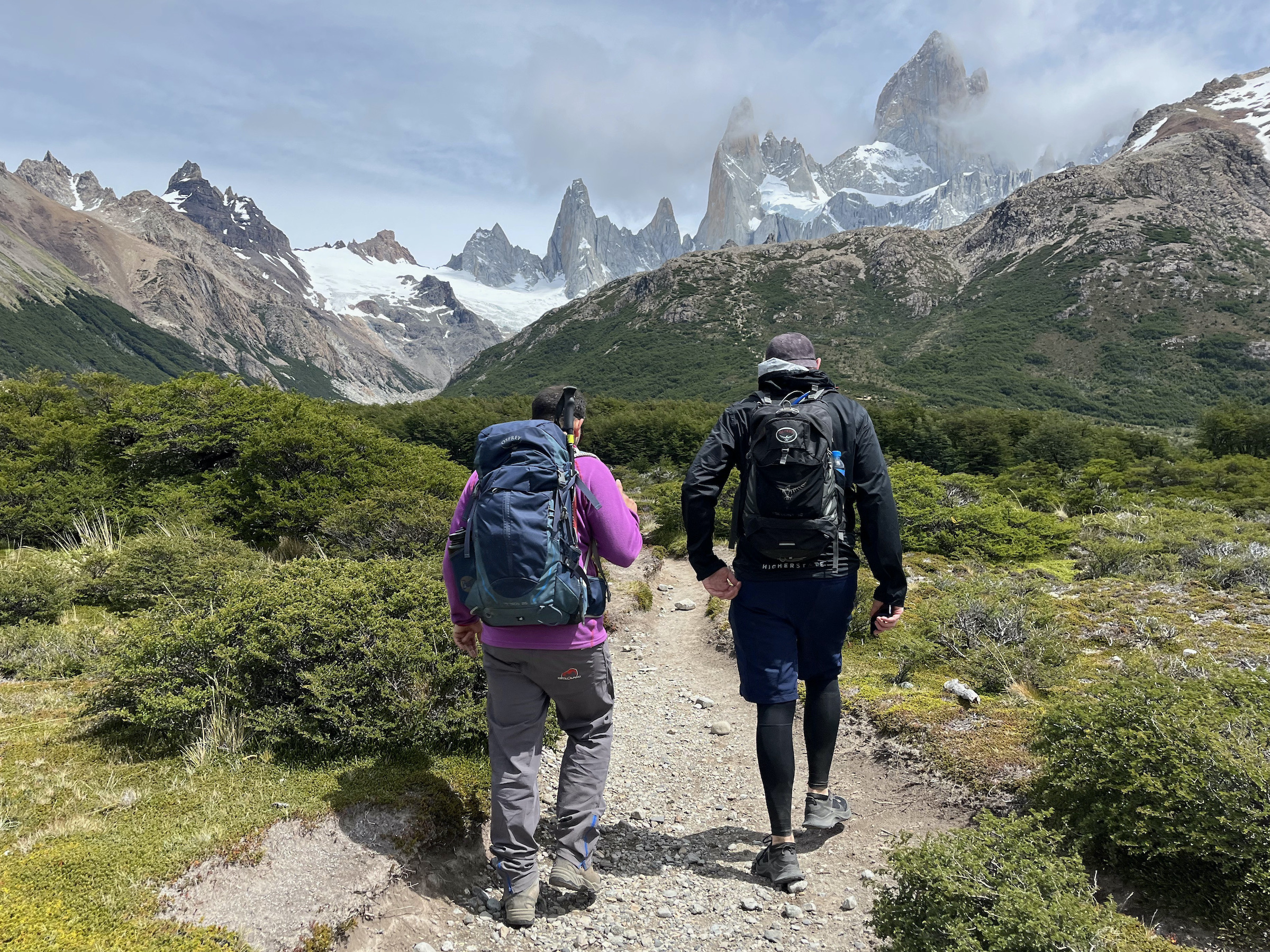 Two hikers walk towards FitzRoy in Los Glaciares National Park