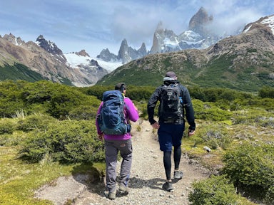 Two hikers walk towards FitzRoy in Los Glaciares National Park