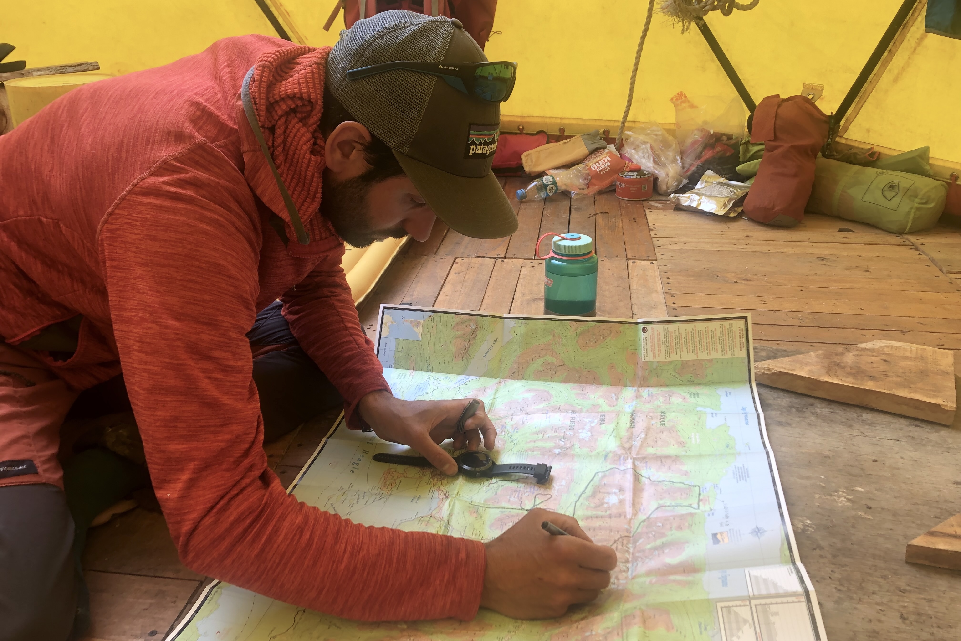 Hiking guide with map planning a route in Patagonia